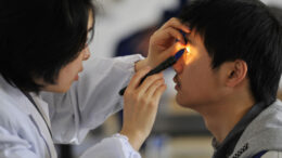 An examinee takes an ophthalmic test during a military pilot selection in Wuhan