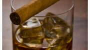 Whisky glass with havanna cigar on the table